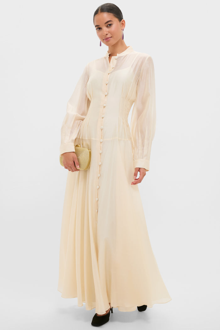Model wearing a classic, full-length dress, accessorized with black heels and a gold clutch, highlights Amethyst Caroline Earrings for an effortless, high-end look.