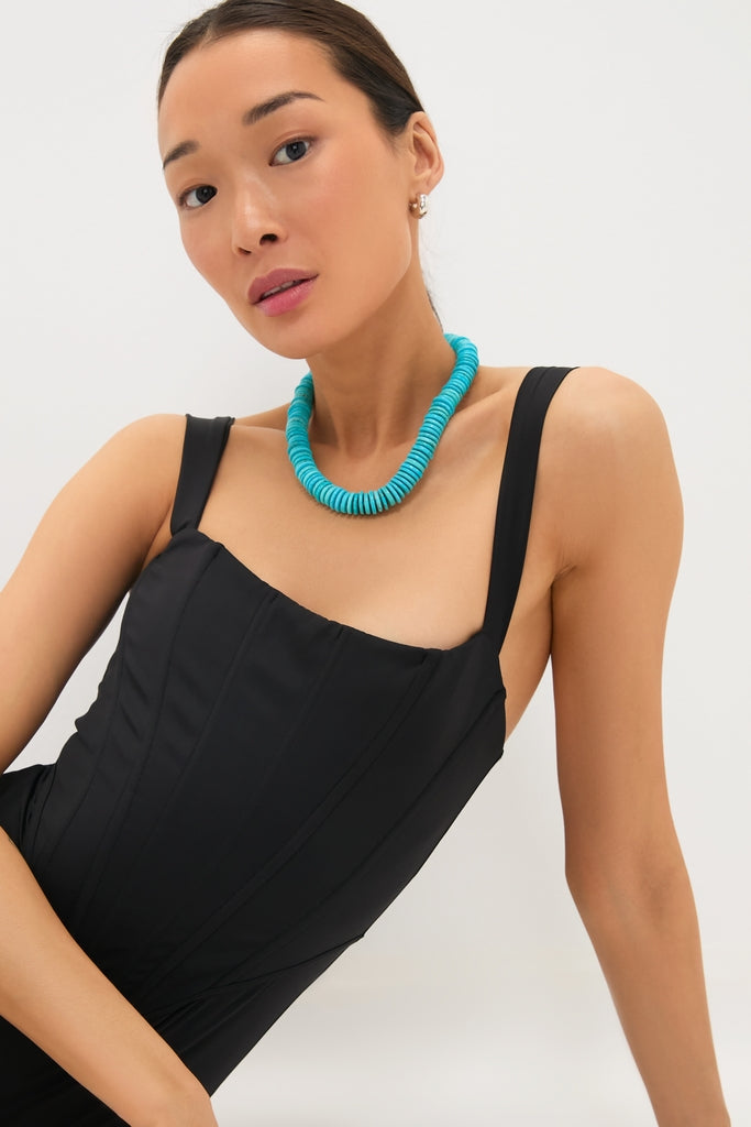 Model wearing the classic Barrell Turquoise Statement Necklace, showcasing its chunky, round-bead design for an effortless, high-end style that's both fun and sophisticated.