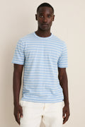 Young Black man models the Bermuda Sail Stripe Sunwashed Tee, showcasing its classic, effortless style. Crafted from high-end, ultra-soft cotton for a fun, relaxed fit.