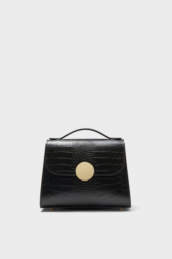 Black Bombo Croco Top Handle Satchel Bag in glossy leather, featuring a crocodile texture, gold-tone clasp, and trapezoidal shape, exudes classic and effortless high-end style.