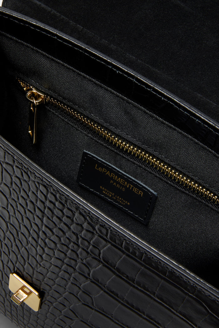 Black Bombo Croco Top Handle Satchel Bag exudes effortless elegance with classic crocodile-embossed leather, gold hardware, and versatile compartments. A fun, high-end accessory for any occasion.