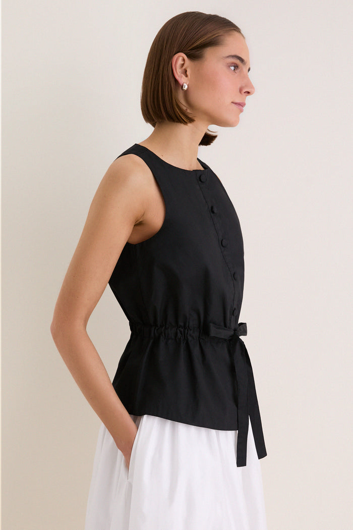 Black Cotton Poplin Francoise Top: classic, sleeveless top with high neckline, cinched waist, and button-front, exuding effortless sophistication and fun elegance, perfect for high-end, everyday style.