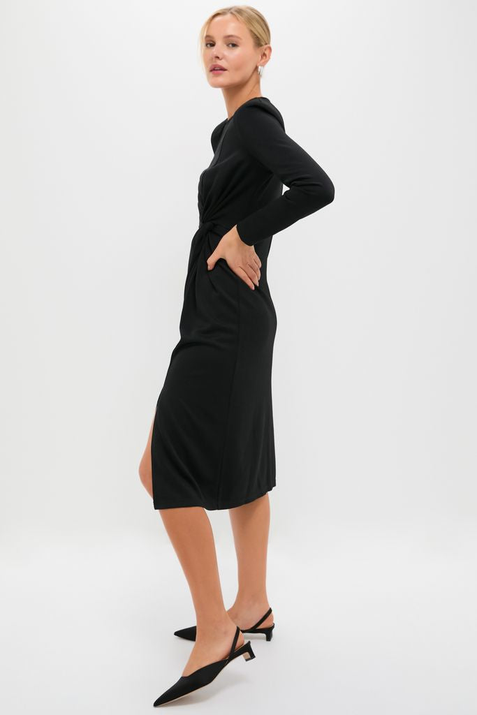 Classic Black Jersey Knit Wilbanks Midi Dress, featuring effortless twist detailing and a fun leg slit, paired with pointed-toe slingback heels for a high-end, sophisticated look.