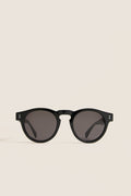 Classic Black Leonard Sunglasses with round lenses and a sleek key-hole bridge, embodying effortless style and fun luxury, perfect for high-end everyday wear.