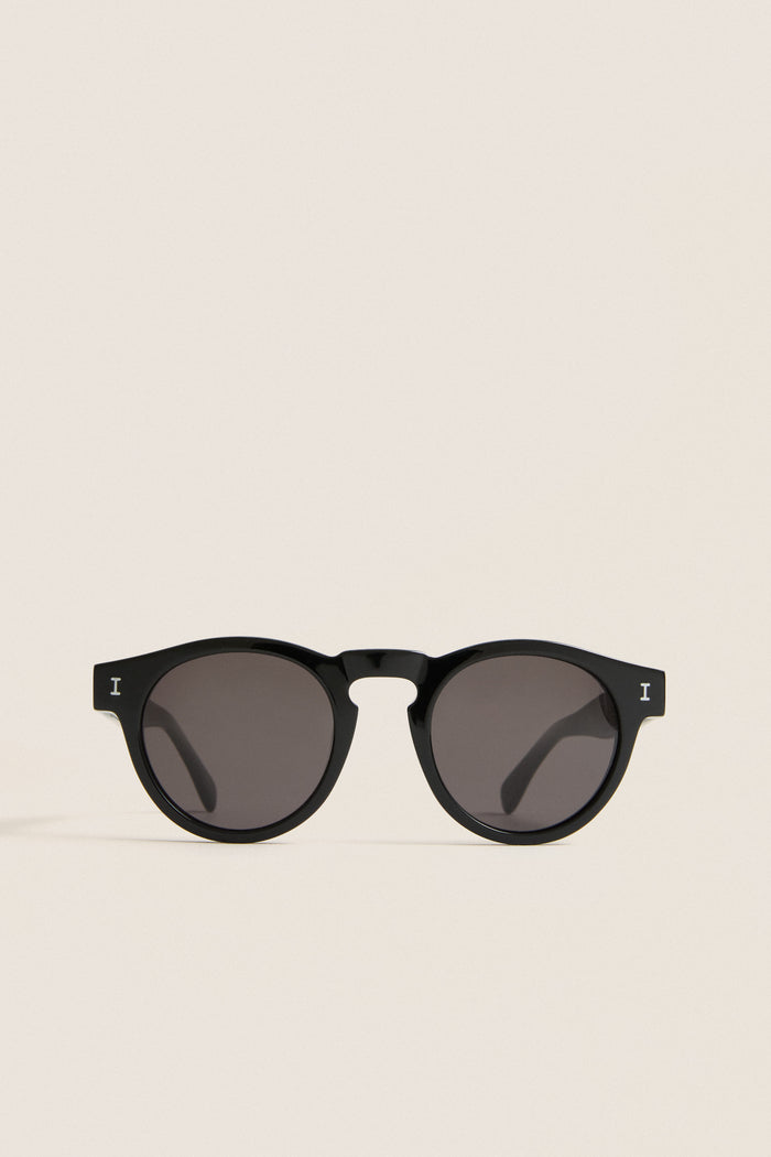 Classic Black Leonard Sunglasses with round lenses and a sleek key-hole bridge, embodying effortless style and fun luxury, perfect for high-end everyday wear.