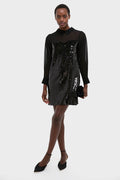 Black Sequin Josie Dress: A classic, high-end dress with glossy sequins and a sheer yoke, paired effortlessly with a black clutch and pointed sling-back flats.