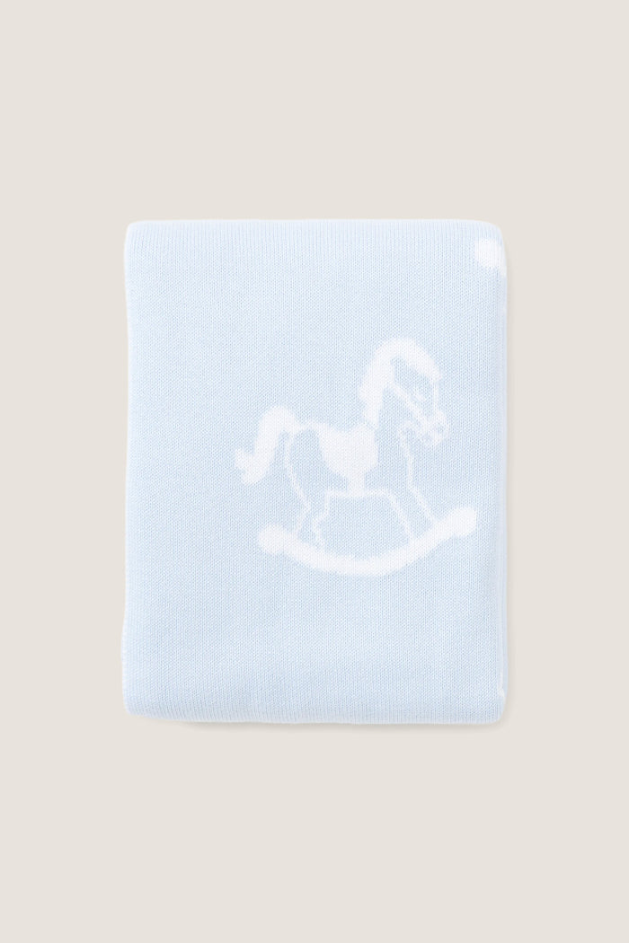 Blue Rocker Knit Blanket with classic rocking horse motif, crafted from ultra-soft cotton for an effortless and fun nursery touch. Ideal for high-end comfort.