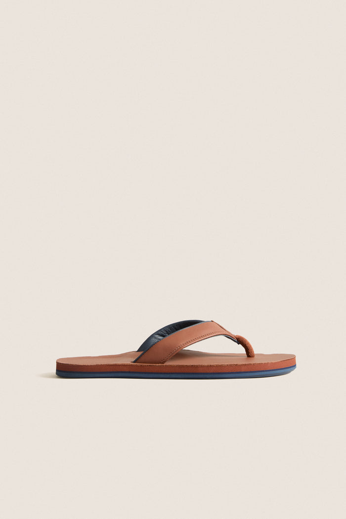 Cask Clipper Waterproof Leather Sandal: Classic and effortless flip-flop with warm tan leather, memory foam, and arch support, perfect for fun, high-end coastal adventures.