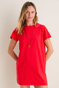 Cerise Margo Mini Dress: A classic, effortless T-shirt style in bold red with a fun, high-end silhouette, worn with a starfish pendant necklace.