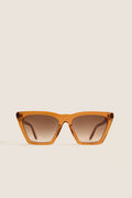 Cider Lisbon Sunglasses feature a classic, effortless cat-eye shape with translucent amber-orange frames, ideal for fun, high-end adventures. Perfect for confident, everyday style.