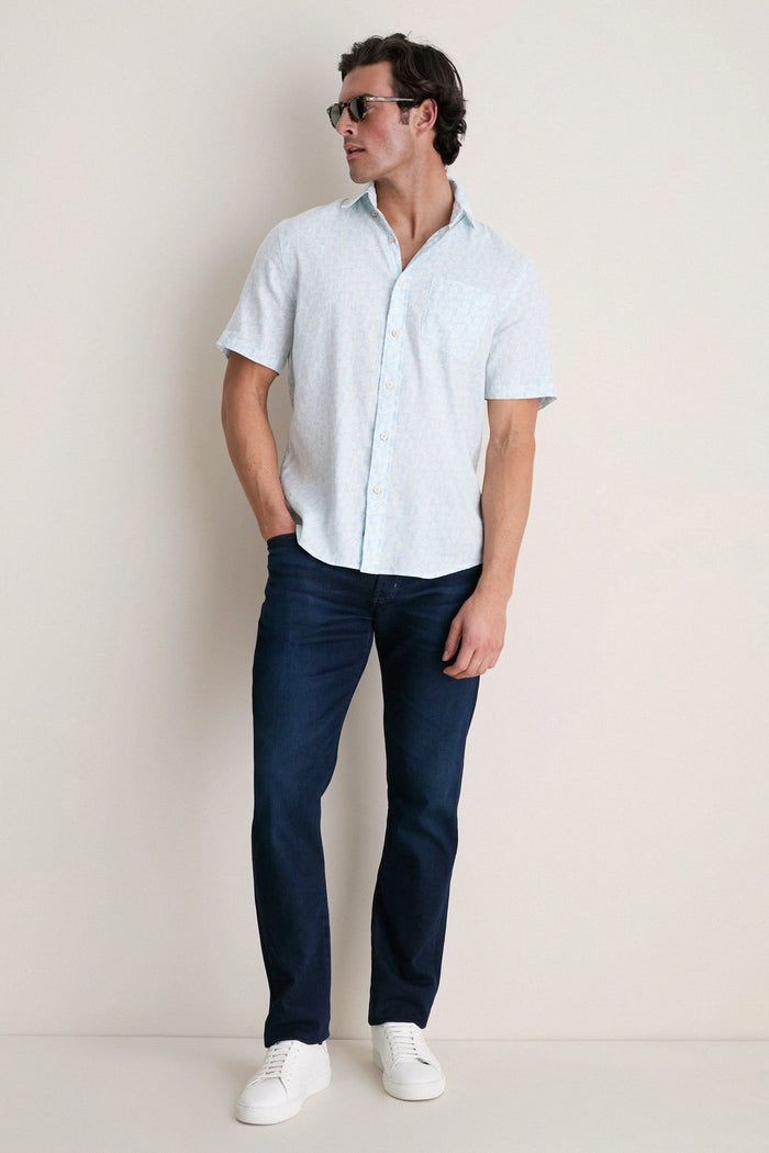 Man wearing the Clear Sky Leaf Breeze Shirt, a classic, effortless piece. Perfect for summer, it features a relaxed fit, subtle leaf print, and high-end comfort.