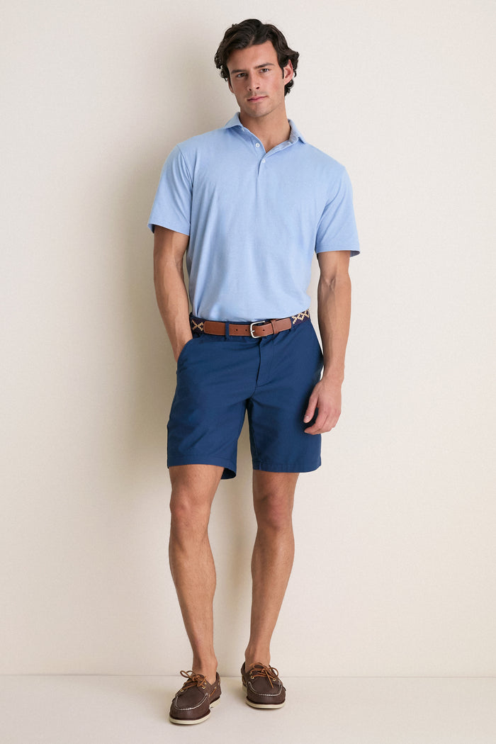 Man in a Cloudy Blue Ryles Crown Flex Cotton Polo, showcasing an effortless, classic style with a cutaway collar and casual fit, embodying high-end, fun luxury.