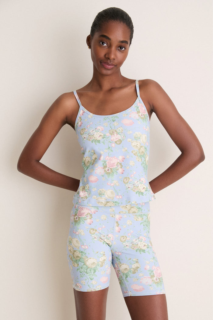 Young woman models the Clubhouse Chintz Compression Spandex Sofia Cami, showcasing its classic, effortless fit with adjustable straps and built-in shelf bra for a high-end, fun style.