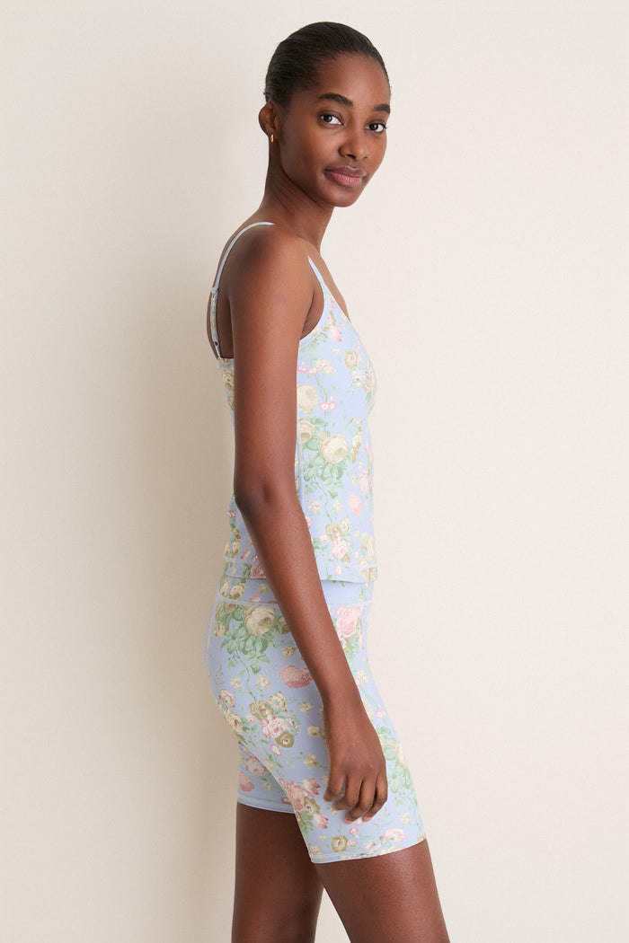 Young woman models the classic, high-end Clubhouse Chintz Compression Spandex Sofia Cami, showcasing its effortless fit and adjustable spaghetti straps for a fun, everyday look.