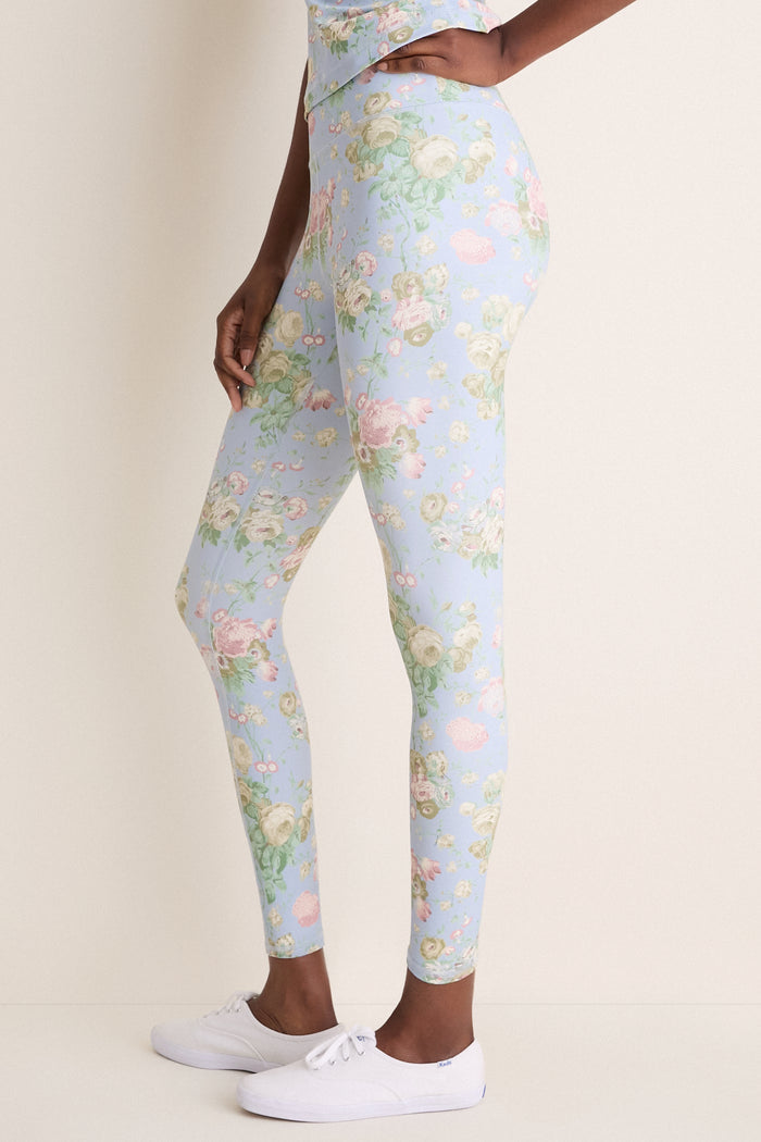 Clubhouse Chintz High Rise Compression Spandex MacKenzie Legging in sky-blue with floral print, paired with white Keds sneakers, embodies classic, effortless style and fun.