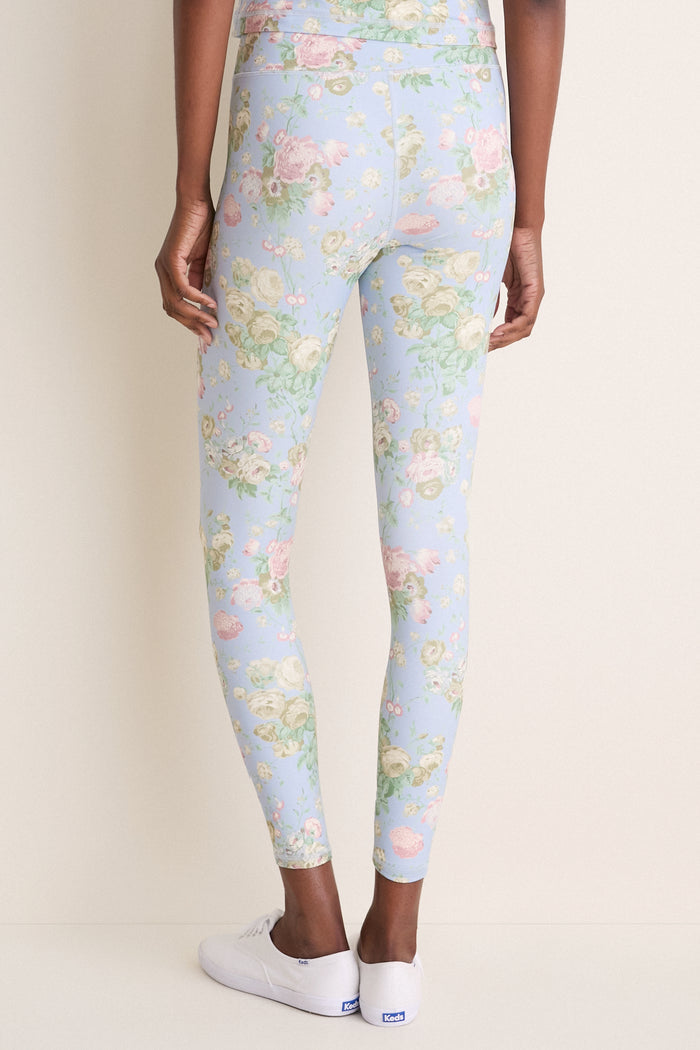 Back view of someone wearing Clubhouse Chintz High Rise Compression Spandex MacKenzie Leggings, showcasing their classic, seamless design paired with white sneakers for an effortless, high-end look.