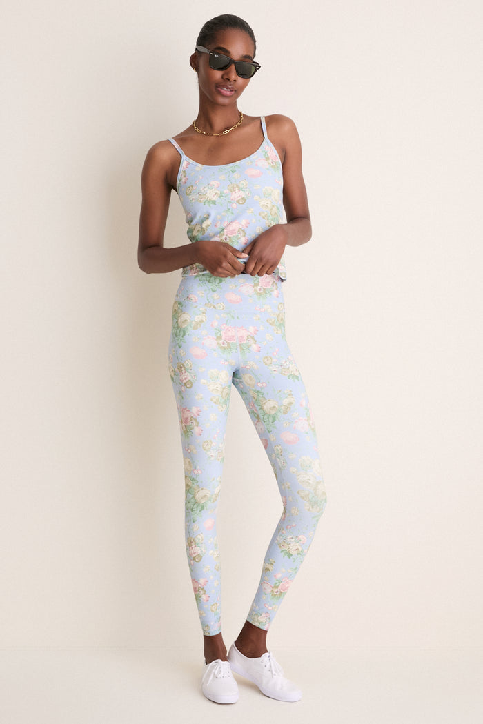 Model in a classic Clubhouse Chintz High Rise Compression Spandex MacKenzie Legging, embodying effortless style with a fun, floral twist and high-end sporty elegance.