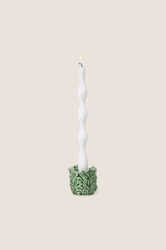 Cruciferous Leaf Taper Candleholder: A classic, effortless white candle with a bubble form in a high-end, intricate leaf-patterned stoneware base, adding fun elegance to any setting.