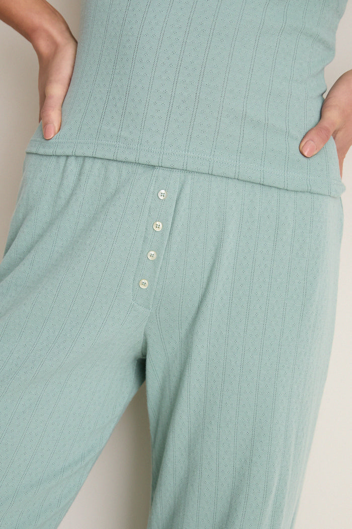 Classic and effortless, the Eucalyptus Pointelle Boxer Pants feature a fun, wide-leg design with eyelet fabric and henley buttons, embodying high-end comfort and style.