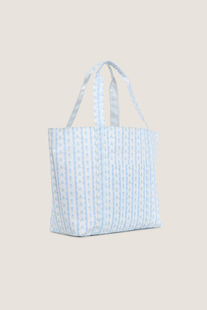 Floral Blue Ribbon Jumbo Tote, a classic and effortless shopper bag with soft blue vertical stripes and tiny floral motifs, perfect for fun, high-end everyday errands.