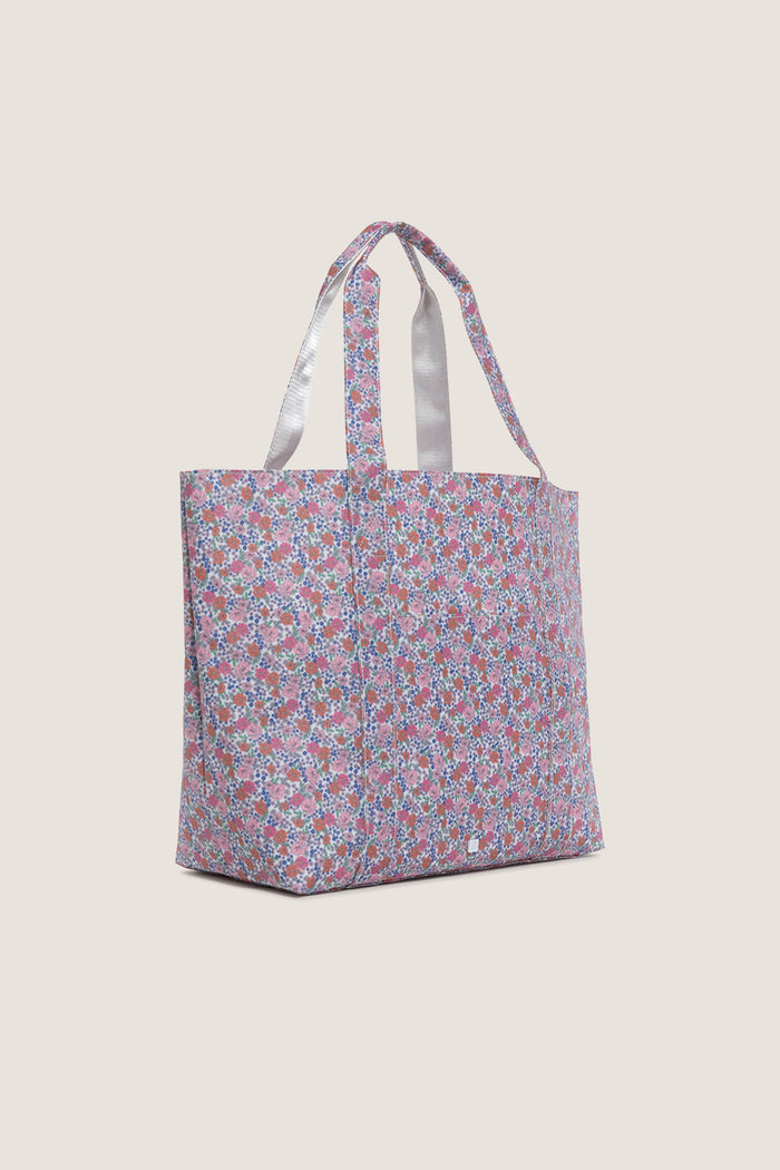 Garden Floral Jumbo Tote featuring a classic, high-end floral print with dual straps for effortless, fun versatility and a wide base for upright stability.