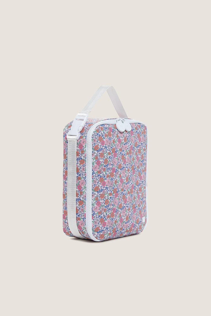 Garden Floral Lunchbox: A classic, effortless carry bag featuring a ditsy floral print, white piping, dual zippers, and an adjustable strap. Perfect for high-end, fun outings.