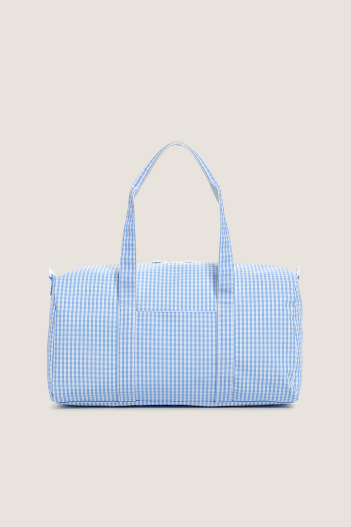 Gingham Sky Weekender Duffel Bag in light blue gingham pattern, featuring a classic, effortless design with dual handles and a playful, high-end feel.