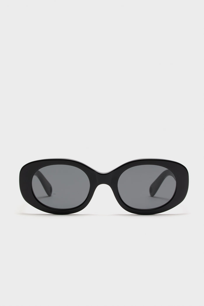 Gloss Black Lyna Sunglasses, oval-shaped acetate frames with dark lenses, offer a classic yet bold look. Effortlessly fun and high-end, perfect for confident, stylish wear.