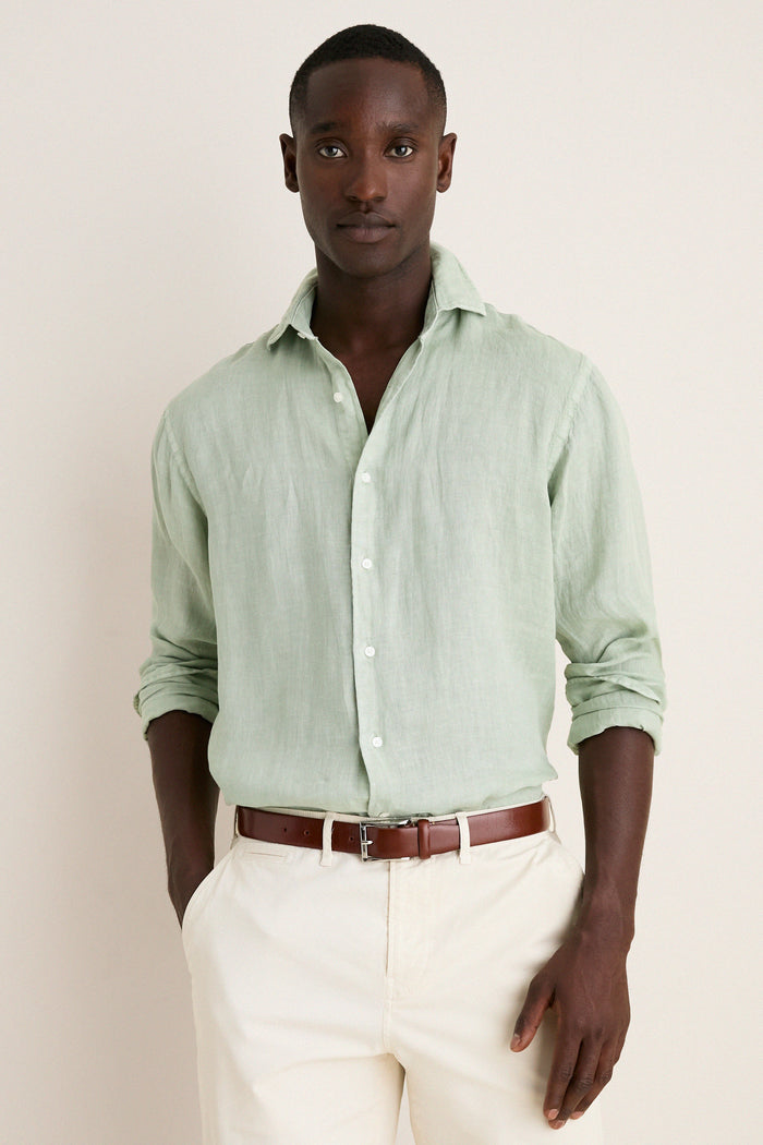 Young Black man models the Grandview Shoreside Linen Sports Shirt, a classic, effortless, high-end button-down, perfect for a fun, confident, and versatile wardrobe.
