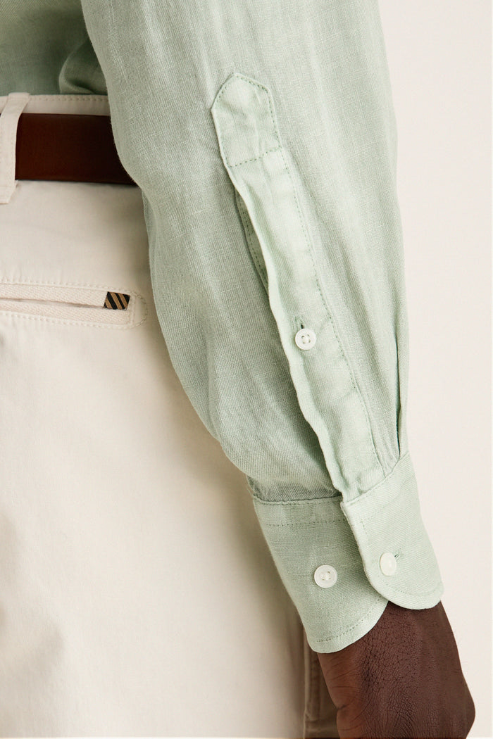 Grandview Shoreside Linen Sports Shirt: Classic, effortless style in mint-green linen, paired with cream chinos and brown belt. Perfect for a high-end, fun, sophisticated look.