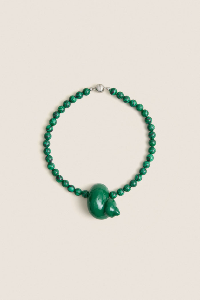 Green Mykonos Necklace: Classic malachite beads with an enamel animal-shaped pendant, silver clasp. Effortless, high-end design for fun, stylish outings.