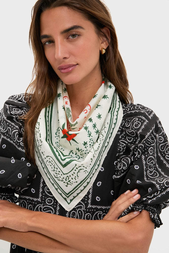 HB x Tuckernuck Stars at Night Scarf, a classic ivory accessory with green motifs, adds effortless, high-end flair to any outfit, embodying fun western style.