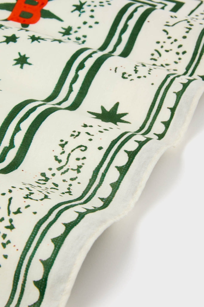 HB x Tuckernuck Stars at Night Scarf featuring green borders, star motifs, and a subtle red “B”. A classic, effortless accessory for a fun, high-end look.