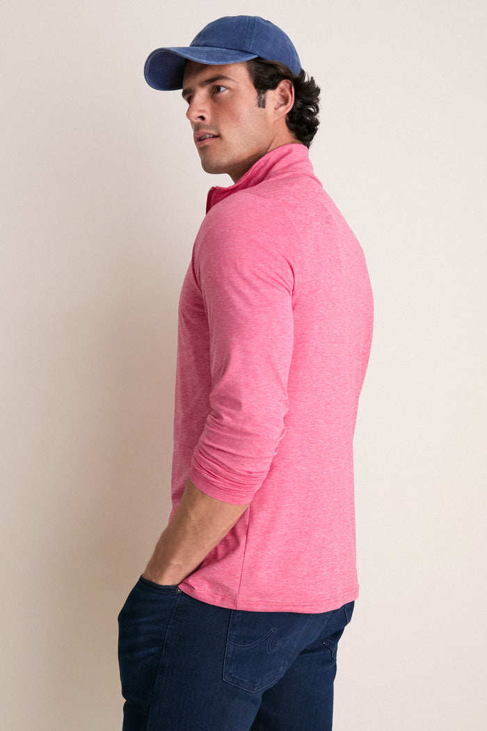 Man in profile wearing Heathered Red Featherweight Performance Pullover, showcasing its classic and effortless style. Perfect for both high-end activities and fun adventures.
