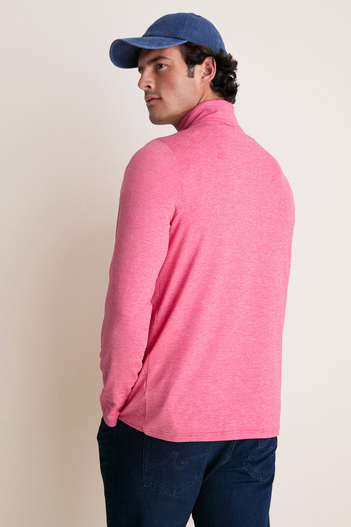 Man in Heathered Red Featherweight Performance Pullover, showcasing its classic, effortless design with cooling, sweat-wicking features, perfect for a high-end, fun lifestyle.