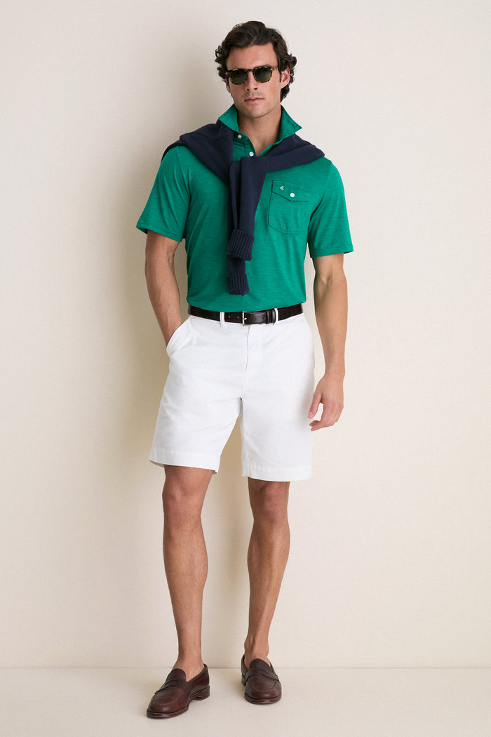 Man models the Home Turf Performance Sport Players Shirt, a classic polo with a 4-button placket, exuding an effortless and high-end summer-casual style.