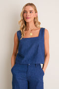 Young woman models the Indigo Roma Top 2, a classic, effortless denim tank with a square neckline, showcasing a chic, high-end, and versatile look.