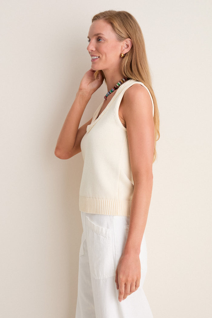 Young woman wearing the Ivory Cotton Rope Mariner Tank, exuding an effortless, high-end style with a classic, fun vibe.