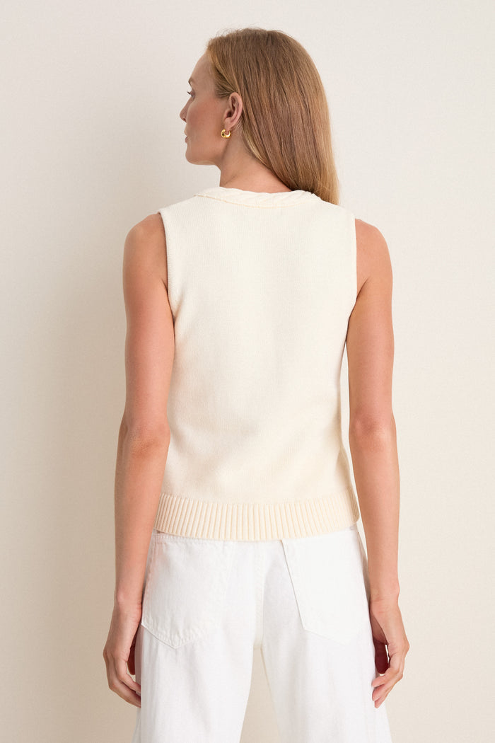 Woman wearing the classic Ivory Cotton Rope Mariner Tank, showcasing an effortless and high-end style with its braided neckline detail and ribbed hem.