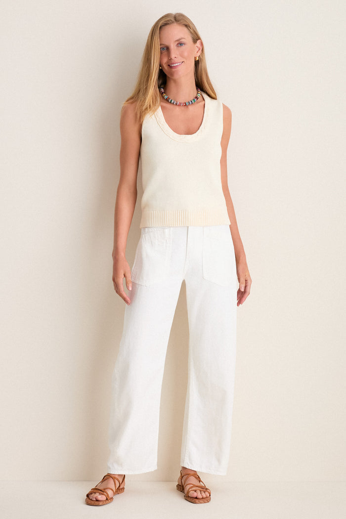 Model wearing the classic Ivory Cotton Rope Mariner Tank, paired with high-waisted pants and sandals, exuding an effortless, fun, and high-end style.