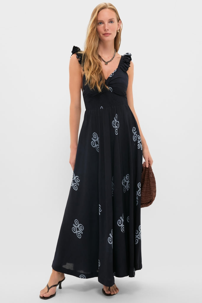 Model in a classic black maxi dress with spiral motifs, accessorized with the Labradorite Sidonie Necklace, exudes effortless elegance and high-end style.