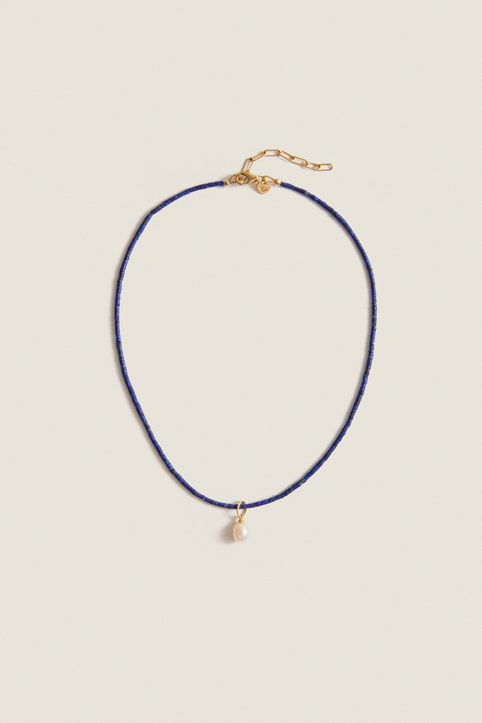 Lapis Lazuli Teeny Gemstone Necklace with Cloud Pearl Charm, featuring a classic, effortless design with high-end detailing, including an adjustable clasp and a fun, removable pearl pendant.