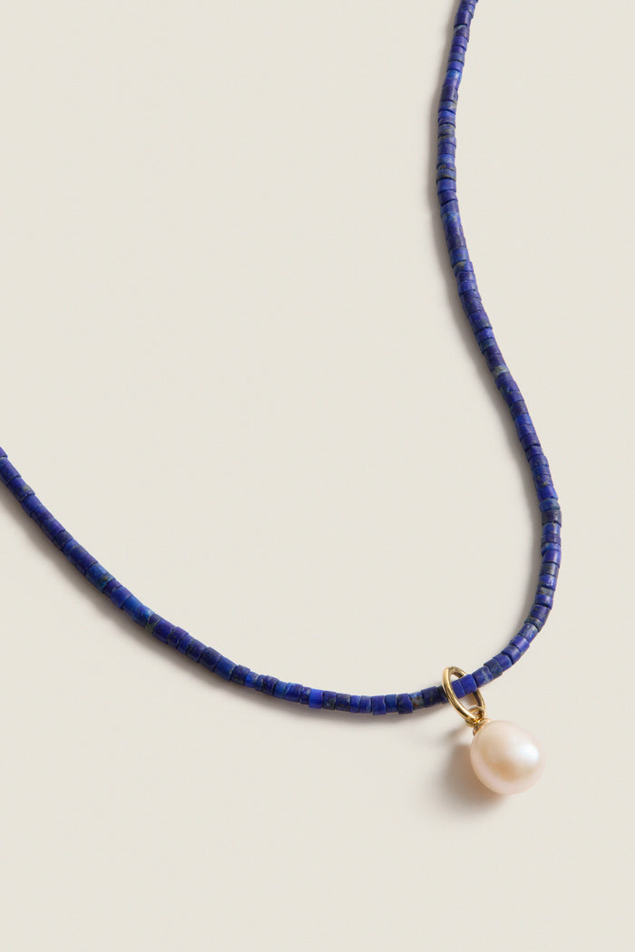 Lapis Lazuli Teeny Gemstone Necklace with Cloud Pearl Charm, featuring classic deep-blue beads and an effortless pearl, perfect for adding fun, high-end style to any outfit.