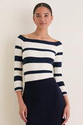 Liberty Stripe Knit Boyers Top on woman, showcasing classic, off-the-shoulder design with variegated stripes, offering an effortless, high-end look perfect for any occasion.