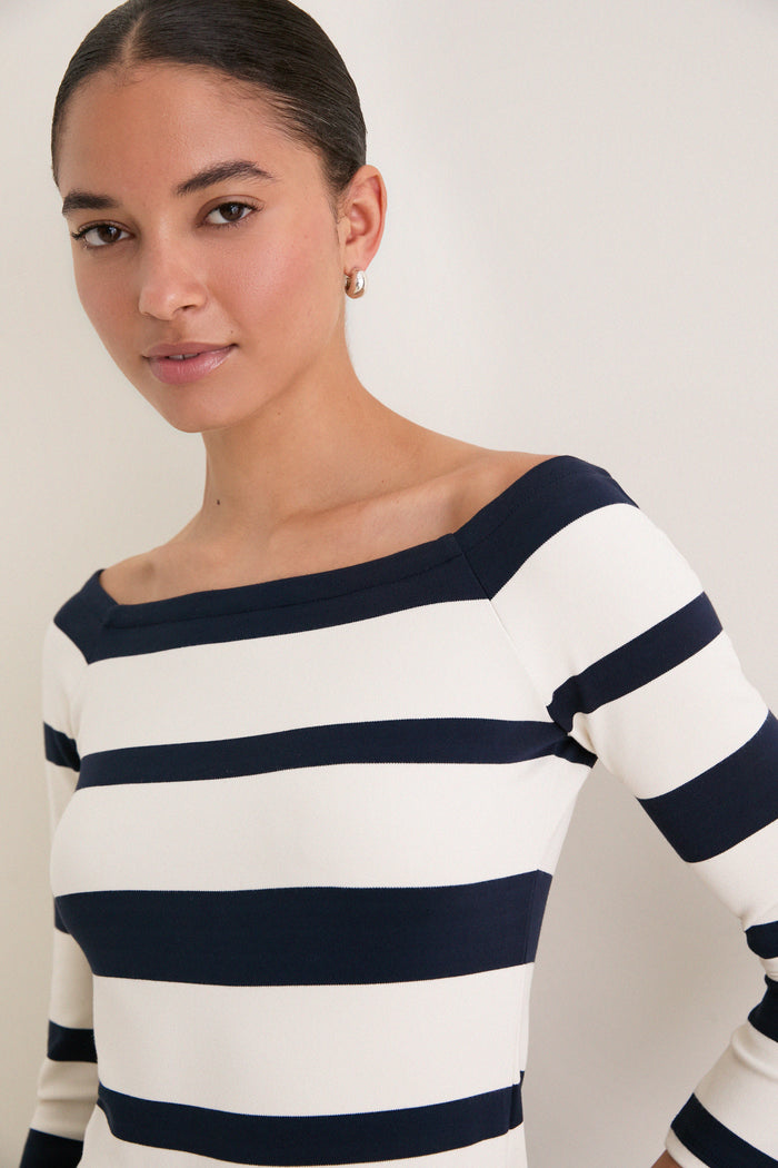 Liberty Stripe Knit Boyers Top showcases classic, effortless style with an off-the-shoulder, fitted silhouette and variegated stripes, embodying Tuckernuck's fun, high-end fashion.