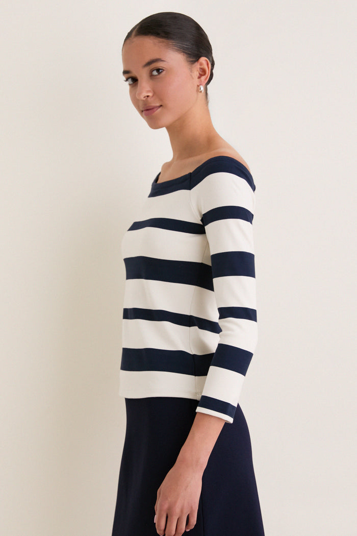Liberty Stripe Knit Boyers Top, showcasing a classic, effortless style. The fitted off-the-shoulder design with three-quarter sleeves offers a high-end, versatile look for fun, modern wear.