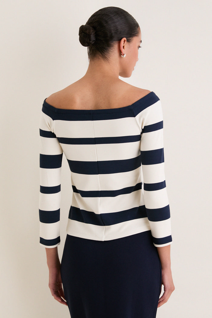 Liberty Stripe Knit Boyers Top: Classic off-the-shoulder, striped top with three-quarter sleeves, paired effortlessly with a navy pencil skirt for an elegant, high-end look.