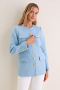 Light Blue Tweed Jennings Jacket: A classic, high-end tweed jacket with gold buttons and flap pockets, exuding effortless elegance, styled with white pants for a fun, professional look.
