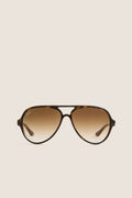 Light Havana Cats 5000 Classic Sunglasses by Ray-Ban feature an aviator style with tortoiseshell frame, gradient lenses, and iconic logo, blending classic elegance with effortless, high-end style.