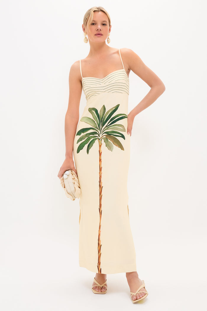 A young woman models a classic slip dress, showcasing Light Natural Brevel Heels for an effortless, high-end look, complete with fun accessories.
